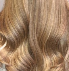 golden colored hair in soft curls